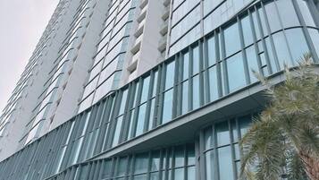 A high-rise building with a curved facade and large windows.
