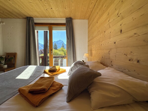 Family Quadruple Room, Balcony, Mountain View | In-room safe, laptop workspace, blackout drapes, iron/ironing board - Hotel Le Cairn (Les Deux Alpes)