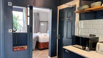 1 bedroom, desk, iron/ironing board, travel cot