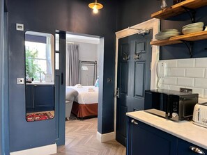 1 bedroom, desk, iron/ironing board, travel cot