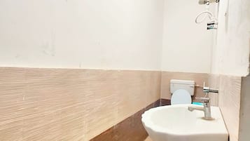 Shower, rainfall showerhead, slippers, towels