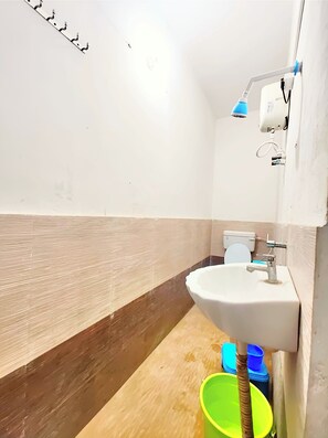 Shower, rainfall showerhead, slippers, towels
