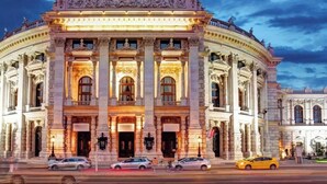 A large, classical building with multiple columns and arched windows. - Chic Room with Private Bath | Mariahilferstraße (Vienna)
