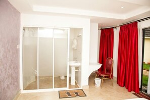 Deluxe Double Room, Garden View | Bathroom | Shower, slippers, towels, soap