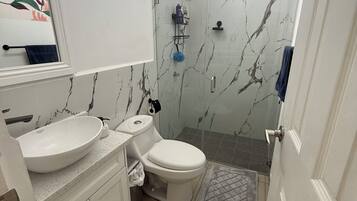 Shower, towels, soap, toilet paper