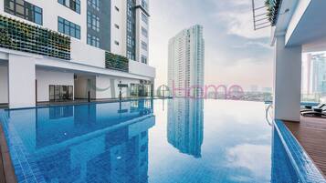 Outdoor pool, open 9:00 AM to 10:00 PM, pool loungers