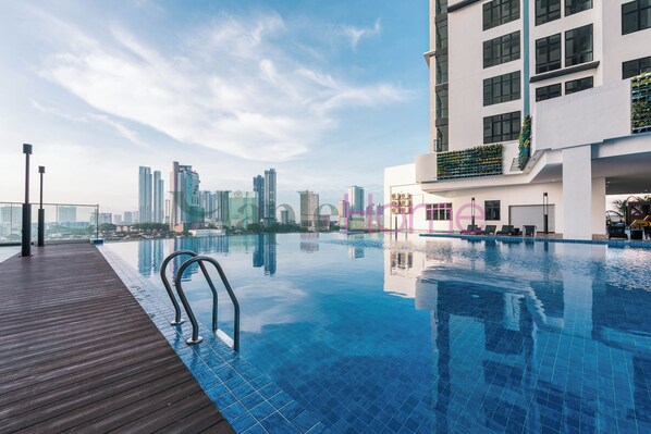 Outdoor pool, open 9:00 AM to 10:00 PM, sun loungers