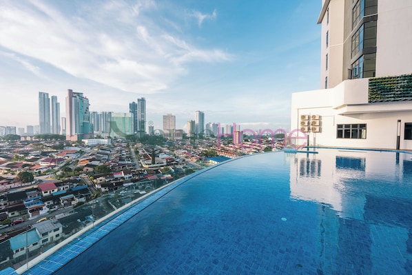 Outdoor pool, open 9:00 AM to 10:00 PM, pool loungers