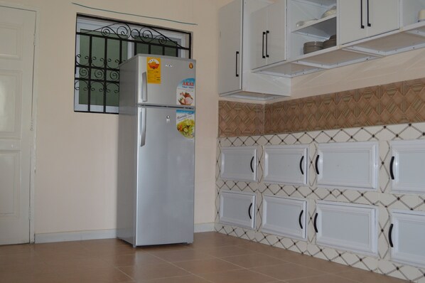 Fridge, microwave, highchair, cookware/dishes/utensils