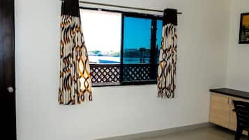 Deluxe Room, Air conditioning, City View | Desk, laptop workspace, free WiFi
