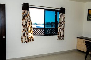 Deluxe Room, Air conditioning, City View | Desk, laptop workspace, free WiFi