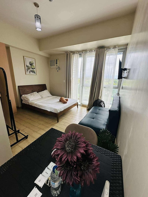 Signature Studio, 1 Queen Bed with Sofa bed, Balcony, City View | Living area | 30-inch Smart TV with digital channels