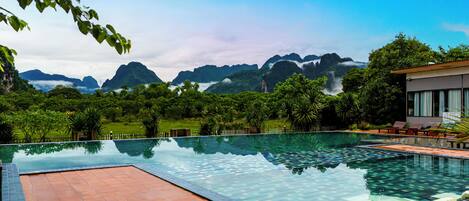 Outdoor pool, pool umbrellas, sun loungers