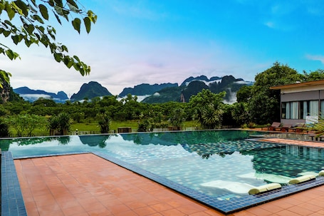 Outdoor pool, pool umbrellas, sun loungers