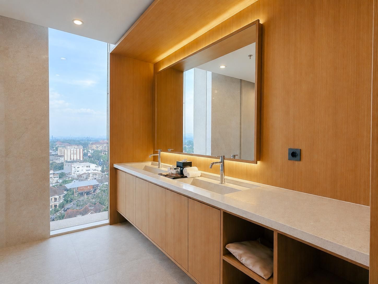 A modern bathroom with a large window, a double sink, and a mirror.