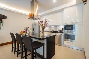 Deluxe Apartment (3 Bedrooms) | Private kitchen | Microwave, oven, highchair - Elegant Beachfront 3BR Condo at Pearl of Naithon (Sa Khu)