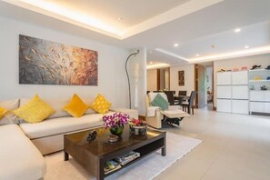 Deluxe Apartment (3 Bedrooms) | Living area | 32-inch TV with cable channels - Elegant Beachfront 3BR Condo at Pearl of Naithon (Sa Khu)