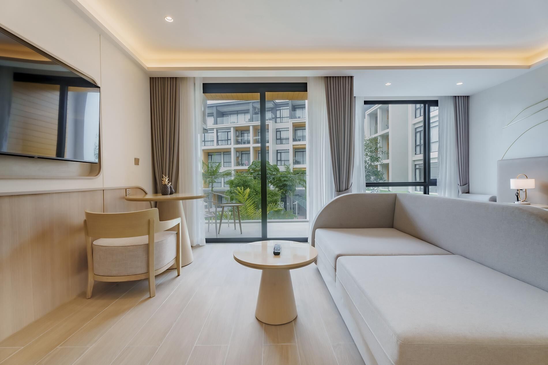 Deluxe Apartment (1 Bedroom) | Living room | 31-inch TV with cable channels