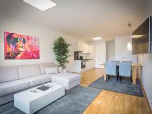 Comfort Apartment, 1 Bedroom, Balcony, Courtyard View | Living area | 60-inch flat-screen TV with cable channels, LED TV, Netflix - WaltzCo City Apartment near U1 & Center (Vienna)