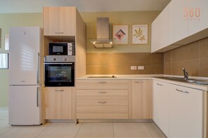 Apartment, Multiple Beds (PTA048) | Private kitchen | Toaster, freezer, dining tables - Pietà City Stay – Stylish Apartments Near Valletta & Waterfront (Pieta)