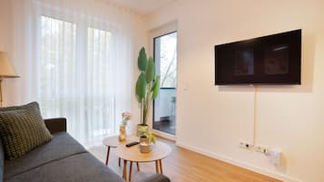 Deluxe-Apartment, 1 Schlafzimmer, Balkon | Wohnbereich