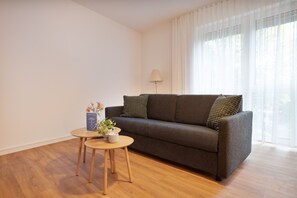 Familjelägenhet - flera sängar - balkong | Vardagsrum