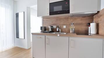 Deluxe Apartment, 1 Bedroom, Balcony | Private kitchen | Fridge, microwave, stovetop, cookware/dishes/utensils
