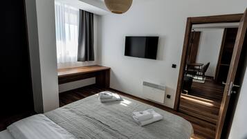 Desk, laptop workspace, blackout curtains, soundproofing