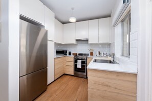 Fridge, microwave, oven, stovetop - Beachside Escape – Bright Apt Steps from Cottesloe Beach with Balcony (Cottesloe)