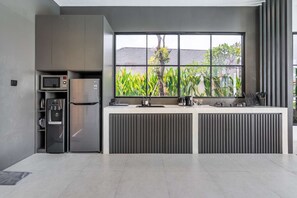 Fridge, microwave, stovetop, coffee/tea maker