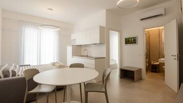 Deluxe Apartment, Patio, City View | Living area