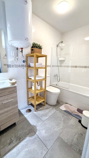 Hair dryer, towels, soap, toilet paper