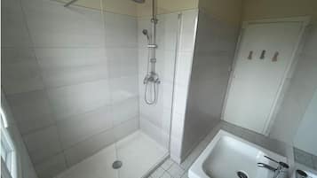 Shower, towels, soap, toilet paper