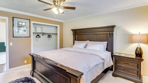 A bedroom with a wooden bed, a nightstand, a ceiling fan, and a framed picture on the wall. - Big Space, Bigger View! Cottonwood Canyon Retreat (Salt Lake City)