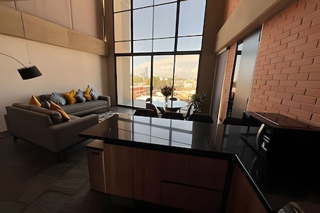 Living area. Penthouse with stunning views of the city of Puebla.