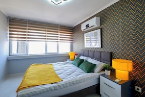 Premium bedding, blackout curtains, soundproofing, iron/ironing board