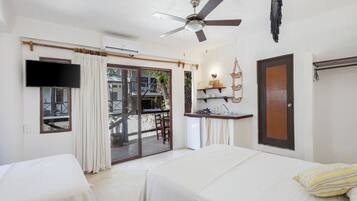 Traditional Quadruple Room, 2 Double Beds, Pool View | In-room safe, individually decorated, individually furnished