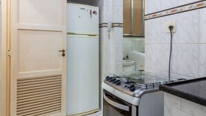 A compact kitchen with a stove, oven, and refrigerator. - 5 Minutes From Copacabana Beach Bi307 (Rio de Janeiro)
