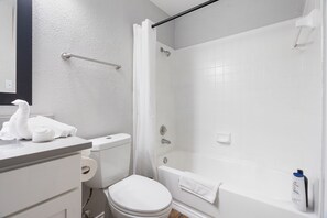 A bathroom with a toilet, a shower, and a bathtub. - Beautiful 1BD/1BA in University Hills 99tn (Austin)