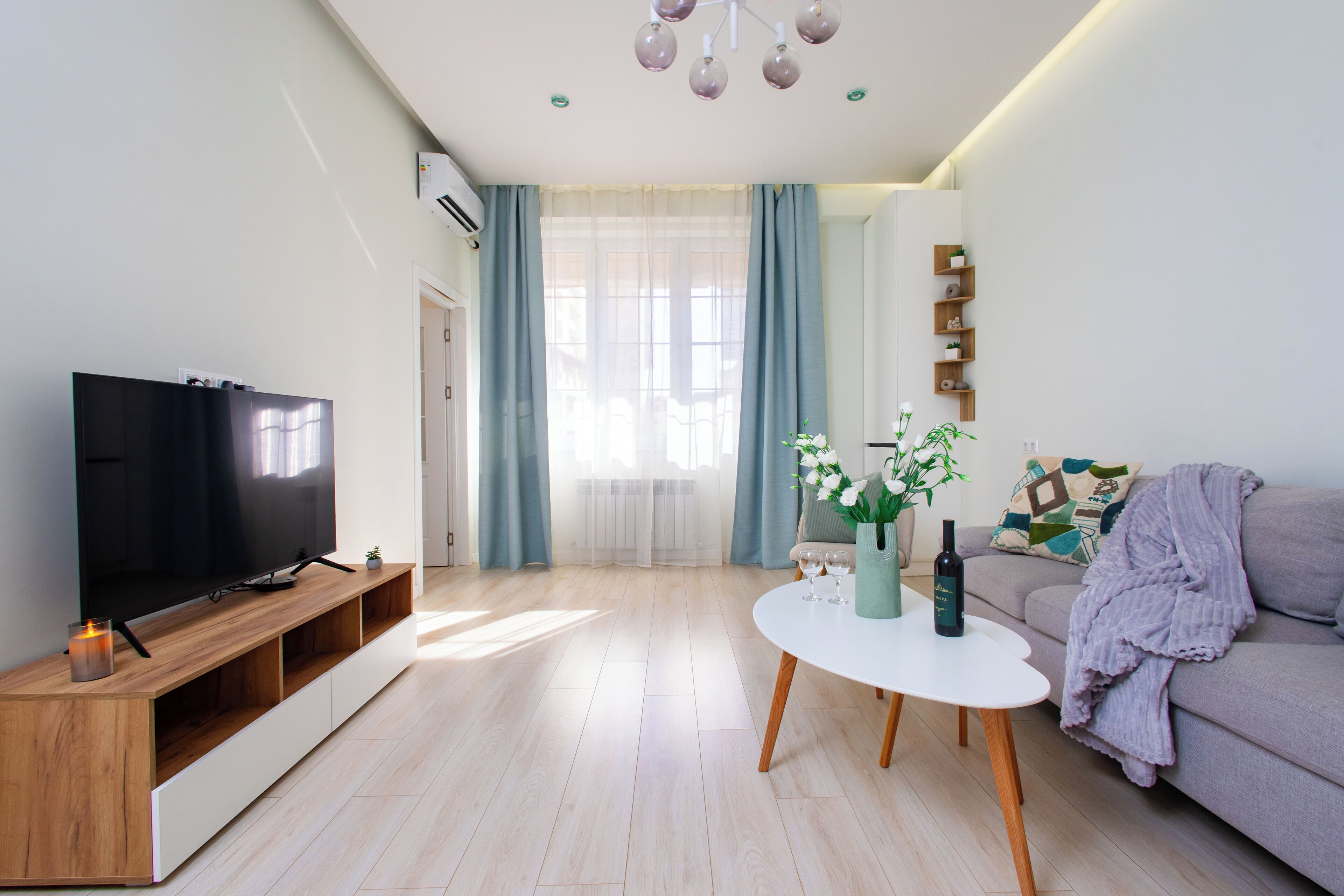 Family Apartment | Living area | 50-inch flat-screen TV with cable channels