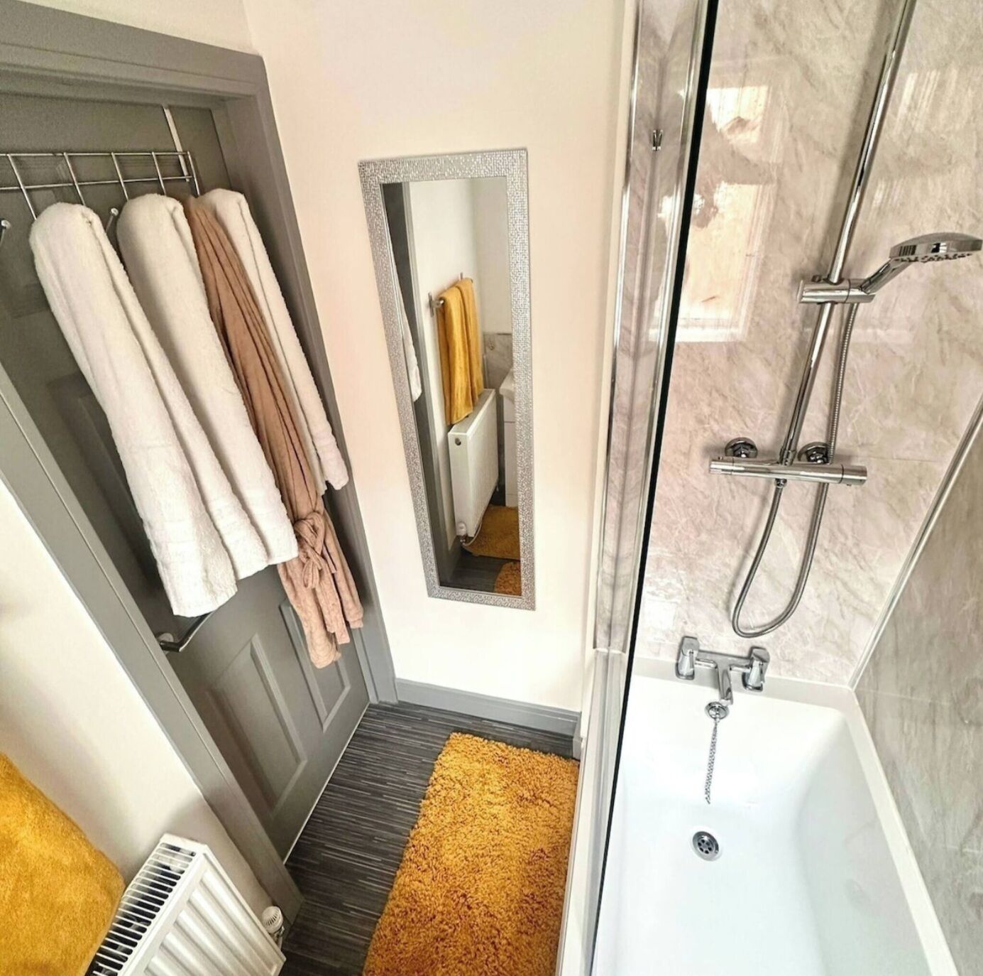 Shower, hair dryer, towels, toilet paper