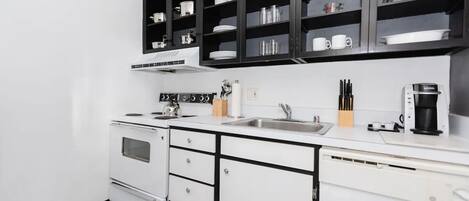 Fridge, microwave, coffee/tea maker, cookware/dishes/utensils