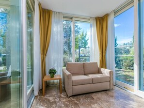 Standard Bungalow, Patio, Garden View | Living area | 32-inch flat-screen TV with digital channels