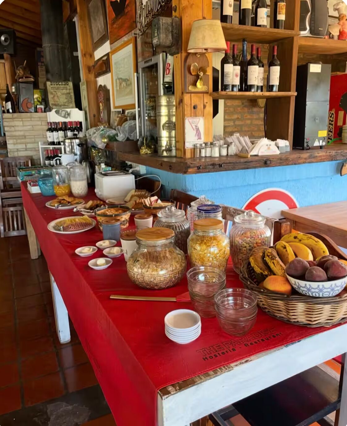 A buffet table with various food items and condiments.