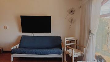 Deluxe Room, 1 King Bed, Sea View (Room 9) | Living area | 50-inch Smart TV with digital channels, streaming services