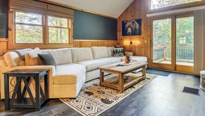 A cozy living room with a sectional sofa, a coffee table, and a fireplace. - Fishing Pond + Pool! Resort Retreat in Wilmington (Wilmington)