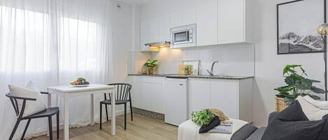 Apartment, 1 Bedroom | Living room | 22-inch flat-screen TV with digital channels