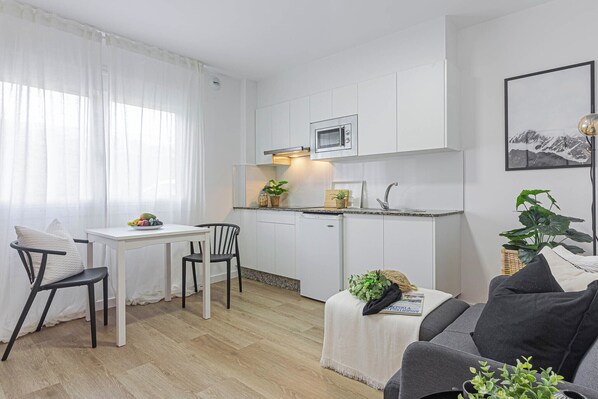 Apartment, 1 Bedroom | Living room | 22-inch flat-screen TV with digital channels