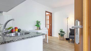 Apartment, 1 Bedroom | Living room | 22-inch flat-screen TV with digital channels