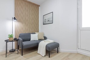 Apartment, 1 Bedroom | Living room | 22-inch flat-screen TV with digital channels